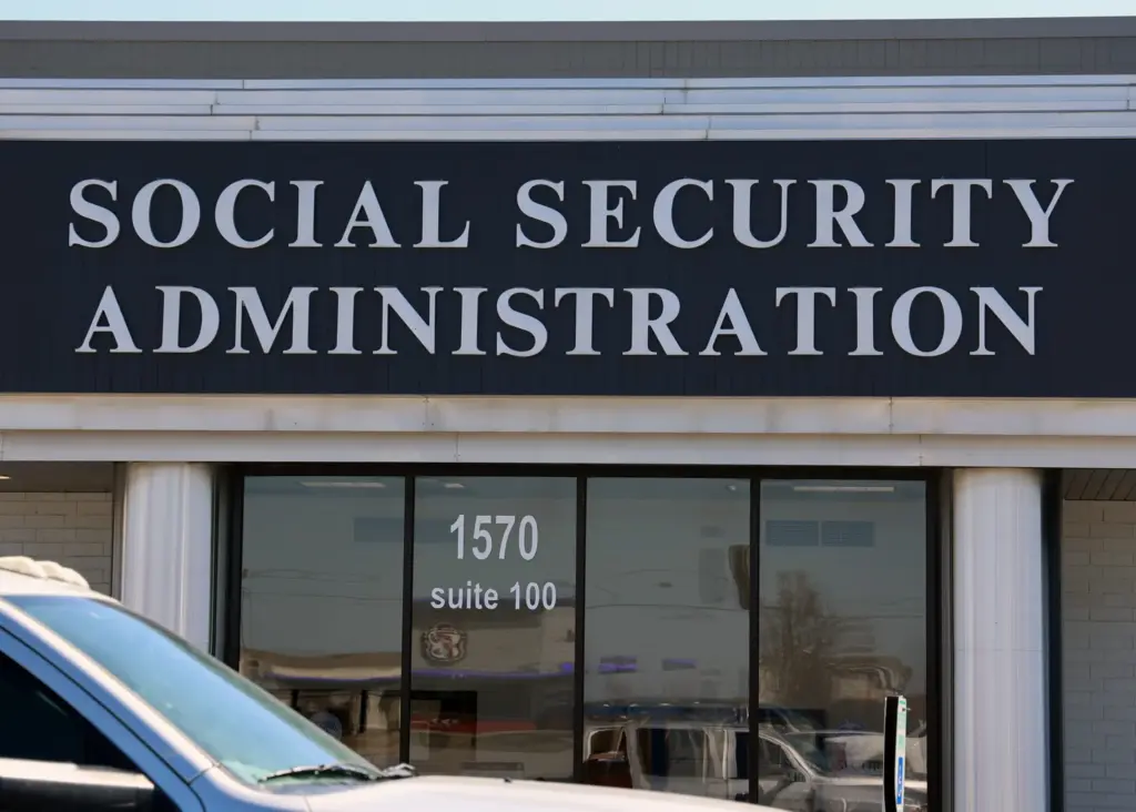 Americans Are Claiming Social Security in Droves—The Shocking Financial Truth Behind It 2 Signage of a Social Security office, indicating the location for benefit claims.